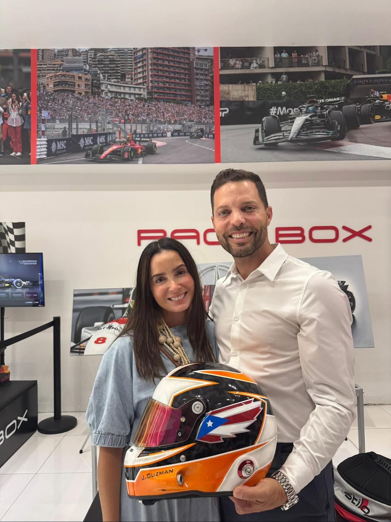 Jason and his wife with his helmet at RaceBox in San Juan